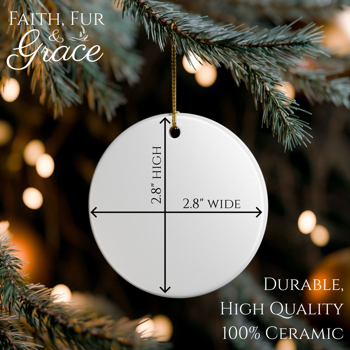 Circular ceramic ornament with dimensions hanging on a Christmas tree.