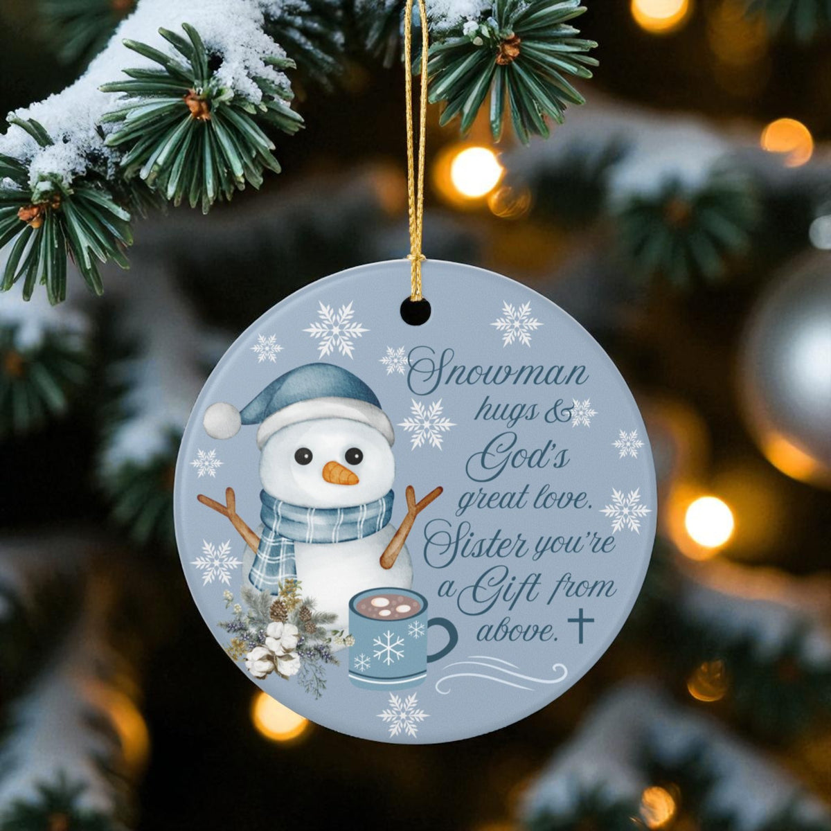 Decorative Christmas ornament with a snowman design on a tree with lights in the background