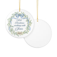 Decorative Christmas ornament with wreath design and text on a white background