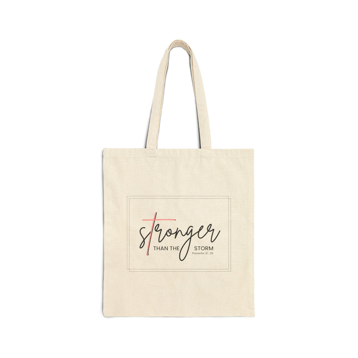 Beige tote bag with 'Stronger Than The Storm' text on a white background