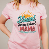 Pink t-shirt with 'Blessed Homeschool MAMA' text design on a plain background
