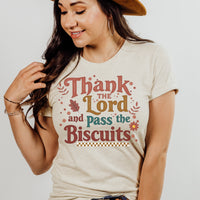 Woman wearing a t-shirt with 'Thank the Lord and Pass the Biscuits' text.