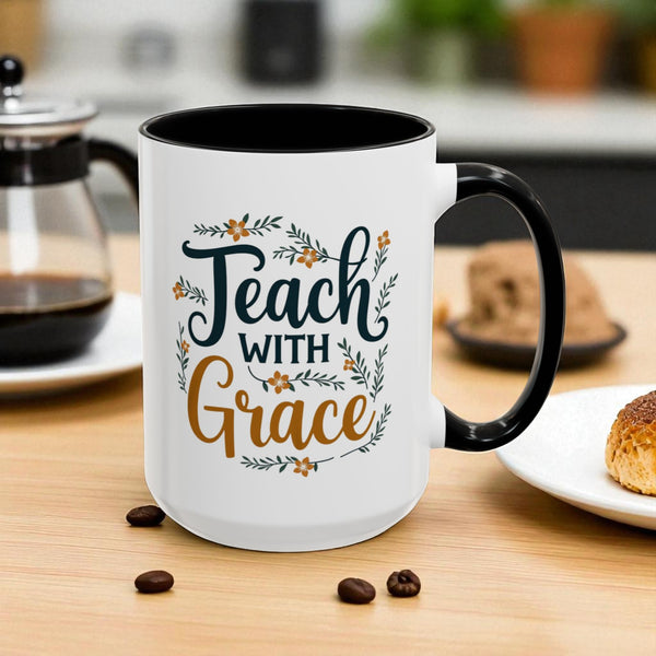 White mug with black interior and handle, featuring 'Teach with Grace' text on a wooden table.