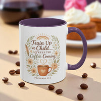 Mug with decorative text and design on a table with coffee beans and pastries