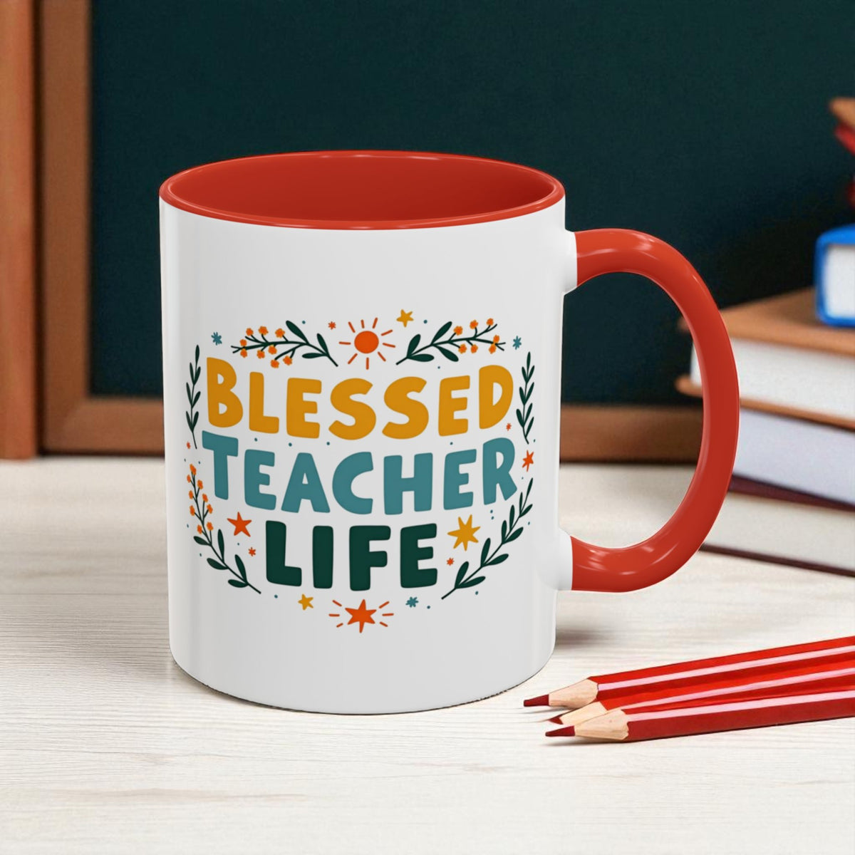 Mug with 'Blessed Teacher Life' text on a desk with books and pencils.