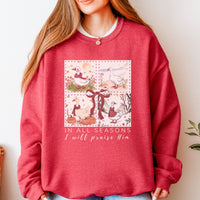 Red sweatshirt with a graphic design and text worn by a person