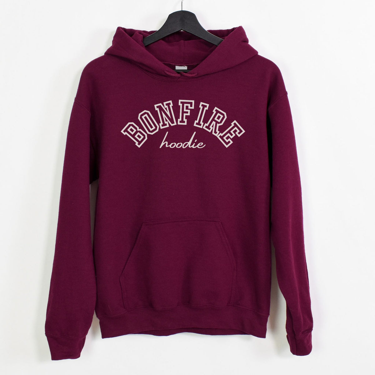 Maroon hoodie with 'Bonfire hoodie' text on a white background