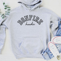 Gray hoodie with 'BONFIRE hoodie' text, denim shorts, and white sneakers on a light background