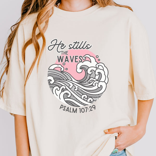 Person wearing a t-shirt with a wave design and text