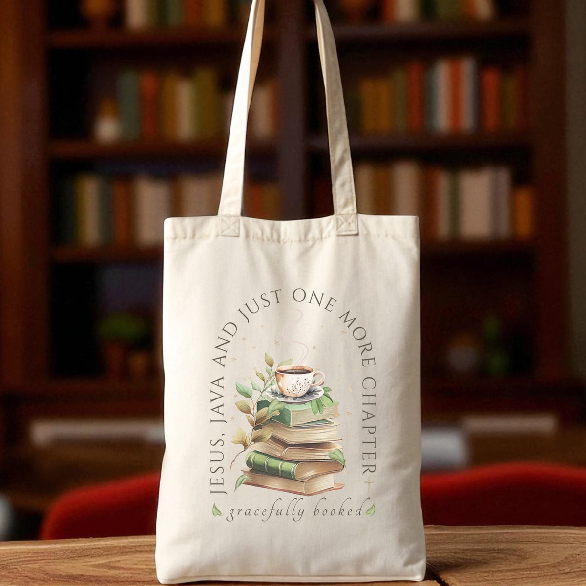 Tote bag with book-themed design and text on a wooden table with a bookshelf background