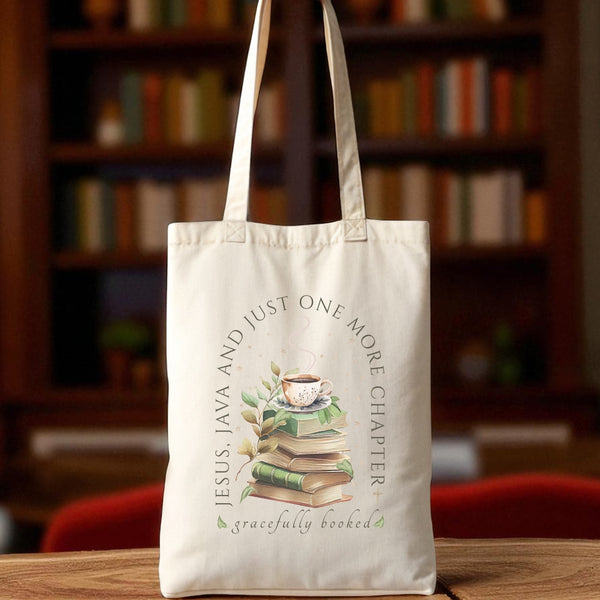 Tote bag with book-themed design and text on a wooden table with a bookshelf background