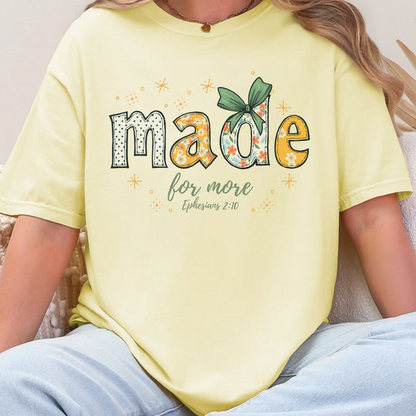 Person wearing a yellow t-shirt with a motivational quote and design.