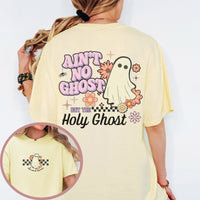 Yellow t-shirt with ghost graphic and text 'Ain't no ghost but the Holy Ghost' on a white background.