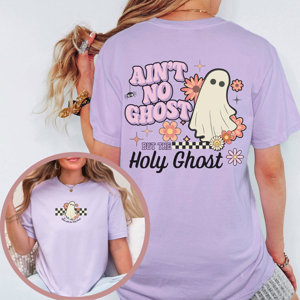 Person wearing a purple t-shirt with a ghost graphic and text, on a plain background.