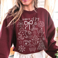Maroon sweatshirt with Christmas-themed graphics and 'season of joy' text worn by a person.