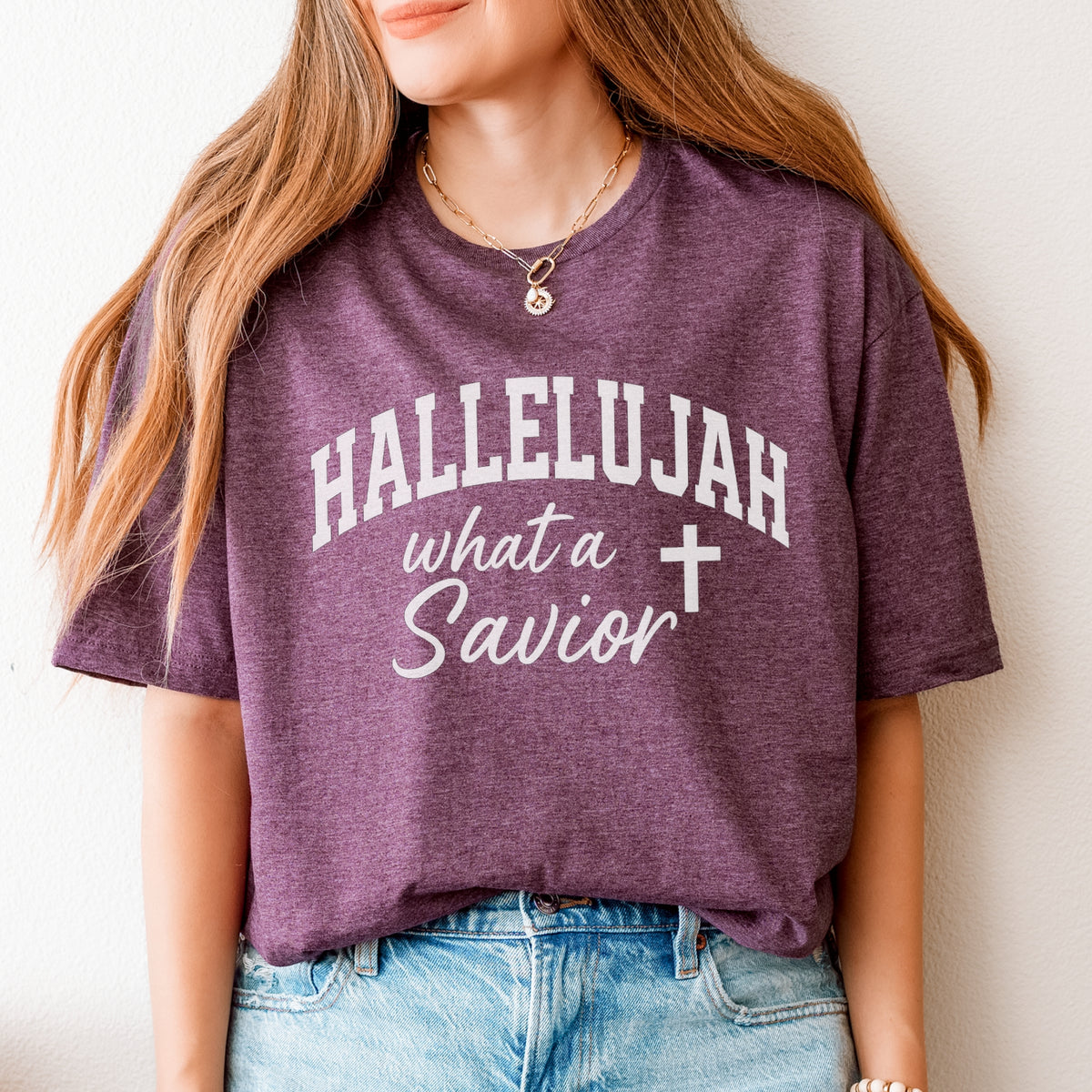 Person wearing a purple t-shirt with 'HALLELUJAH what a Savior' text.