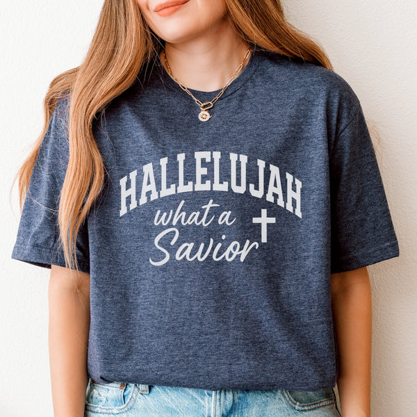 Person wearing a blue t-shirt with 'HALLELUJAH what a Savior' text and cross symbol.