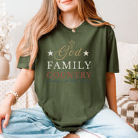 Person wearing a green t-shirt with 'God Family Country' text