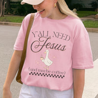Person wearing a pink t-shirt with 'Y'all Need Jesus (and maybe coffee)' text and a goose graphic.