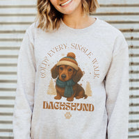 Person wearing a sweater with a dachshund graphic and text